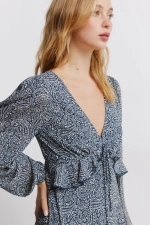 Сукня міді з воланом на талії та принтом