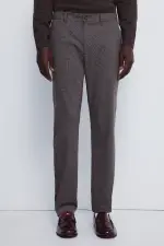 Штани з фактурної тканини крою slim fit