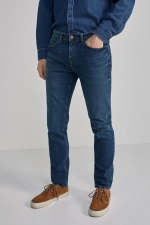 Потерті джинси скінні темного кольору (розмір 31)