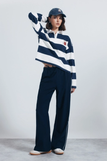 Поло смугасте з довгим рукавом та вишивкою