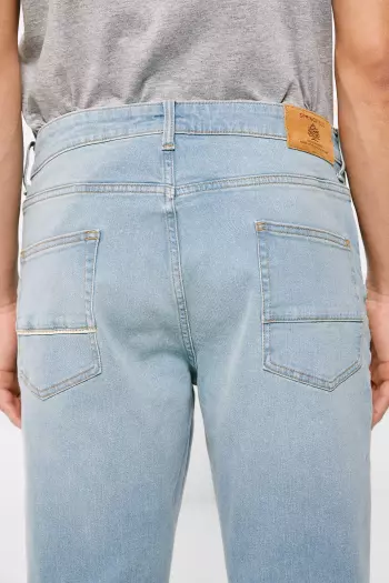 Джинси slim fit із ефектом потертостей