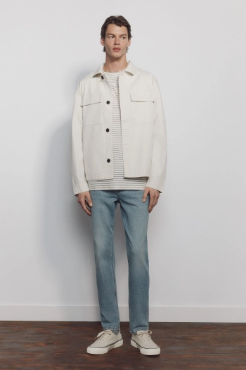 Джинси вузького крою з ефектом додаткового фарбування